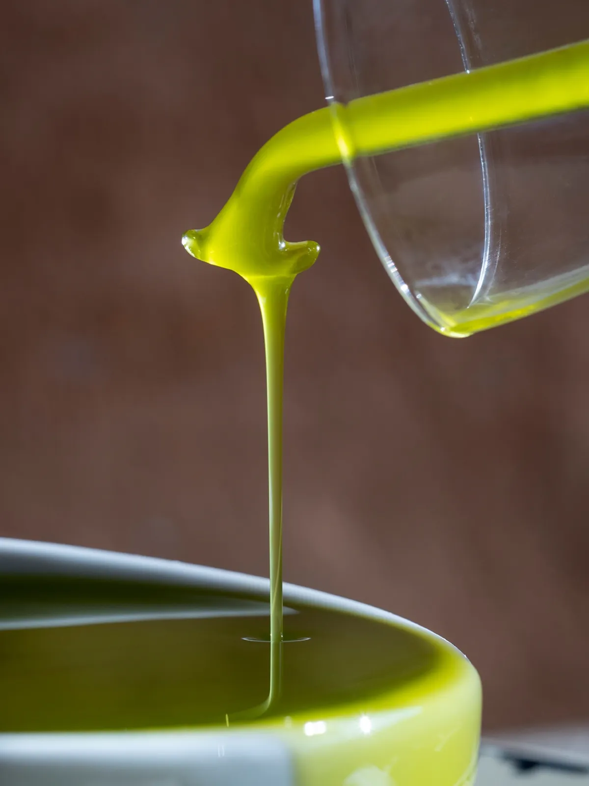 Fresh olive oil pouring